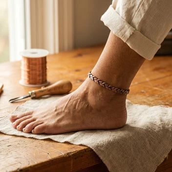 Copper anklet on bare ankle