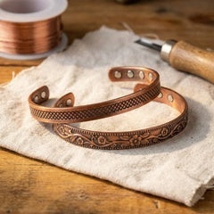 Women's copper bracelets on linen